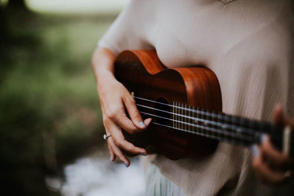 woman strumming ukulele