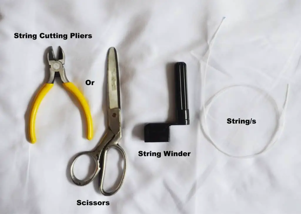 string cutting pliers, scissors, a string winder and strings. 