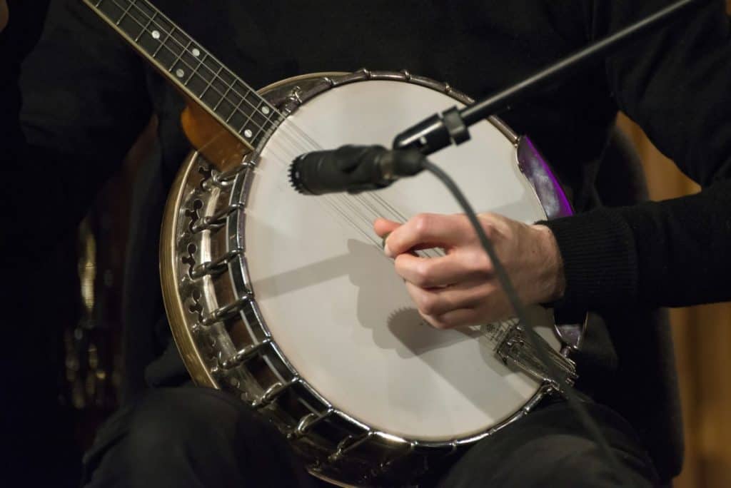 man playing a good quality banjo