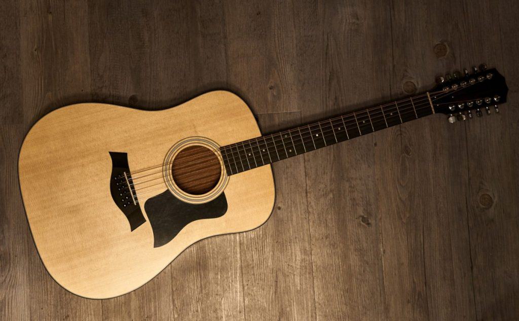 12 string guitar on a wooden floor