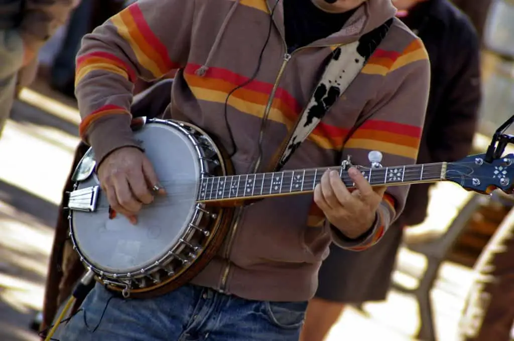 man playing a 5-string banjo