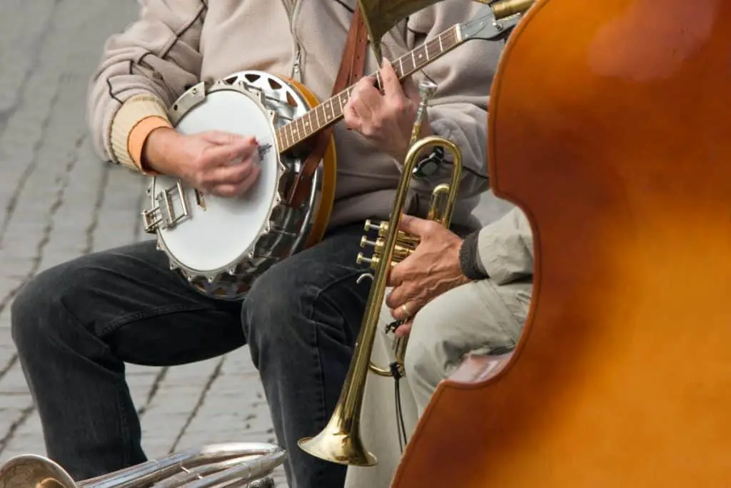 man playing a cello banjo